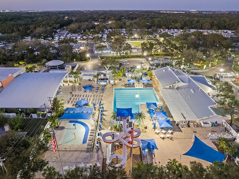 Aerial view of Sun Outdoors Sarasota resort with pools and recreation areas